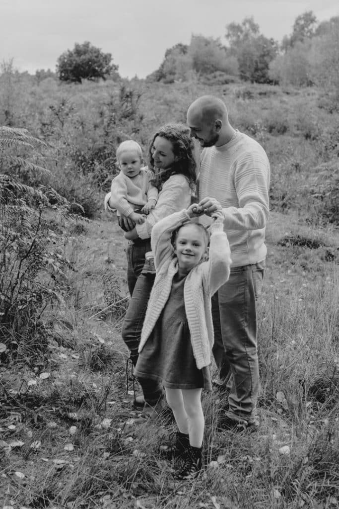 Family is standing close to each other and smiling. Hampshire photo shoot. Hampshire photographer. Ewa Jones Photography