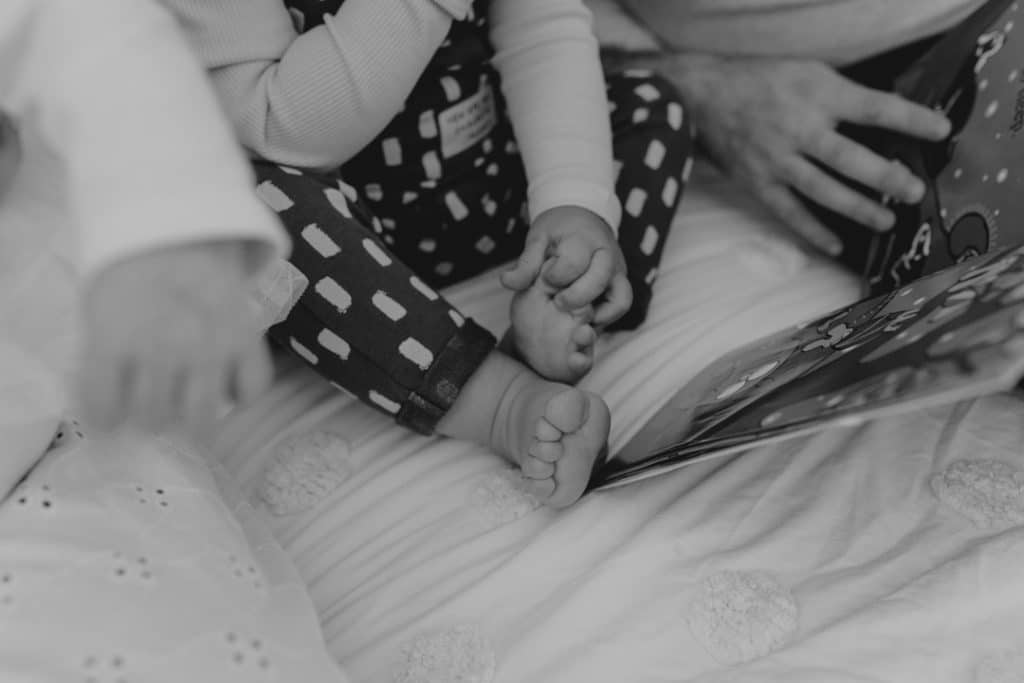 Close up of toddler feet. detail shoots. newborn photo session with an older sibling. Hampshire newborn photographer. Ewa Jones Photography.