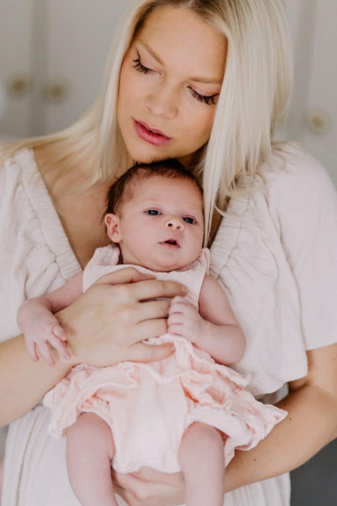Newborn photo shoot in London-23 Mum is cuddling her baby girl. Newborn photo session in London. Lifestyle newborn session. Hampshire photographer. Ewa Jones Photography