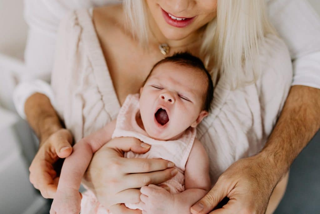 Newborn photo shoot in London-25 Newborn baby girl is yawning. Must have newborn photo session. London newborn photographer. Hampshire photographer. Ewa Jones photography.