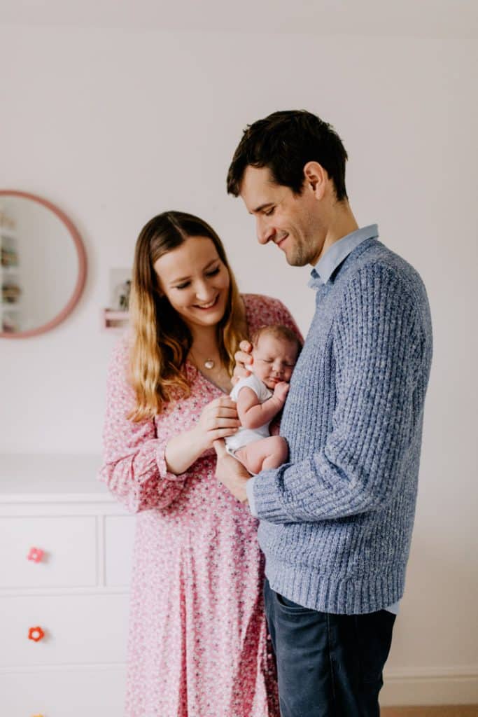 mum and dad are holding their newborn baby girl. Newborn nursery. Hampshire newborn photo session. Basingstoke photographer. Ewa Jones Photography