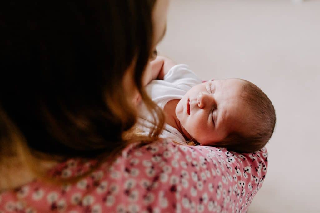 Close up image of newborn baby face. Newborn baby girl is sleeping. Natural in home newborn photo session. Hampshire photographer. Ewa Jones Photography