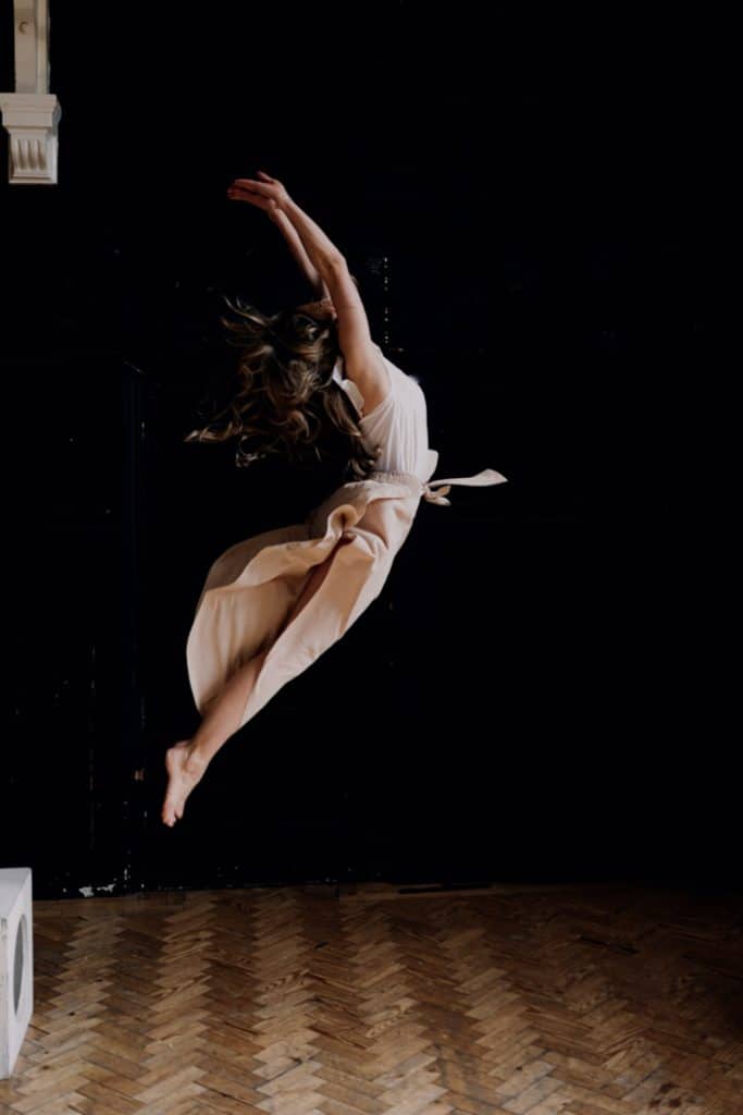 Female is jumping in the air. Female photo shoot in Hampshire. Ewa Jones Photography