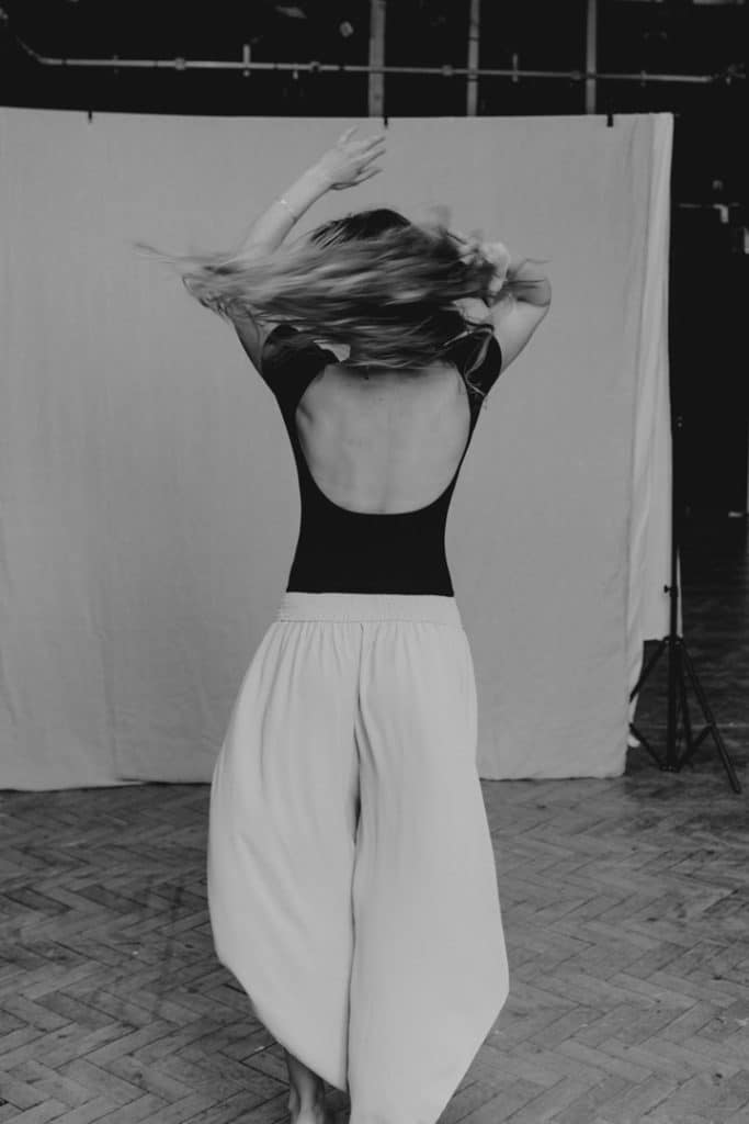 Female is dancing in the studio. Hampshire female photography. Empowering self-love photo shoot. Ewa Jones Photography