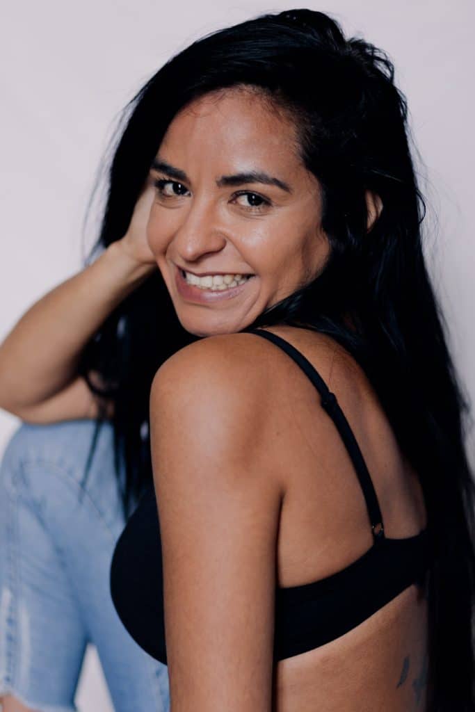 Empowering female sessions-19 Female is looking at the photographer and smiling. Female photo sessions in Hampshire. Hampshire photographer. Basingstoke photographer. Ewa Jones Photography