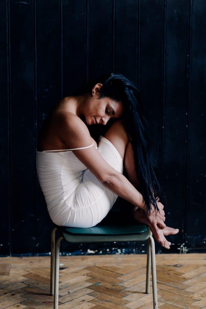 Empowering female sessions-23 Female is sitting on the chair and wearing white dress. Boudoir intimate female photo sessions in Basingstoke Hampshire. Ewa Jones Photography
