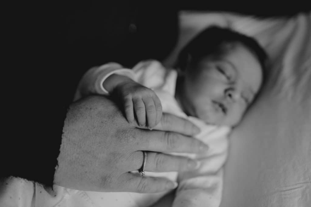 close up of mummy's and baby's hand. Black and white image. Newborn photo session. Hampshire photographer. Ewa Jones Photographer