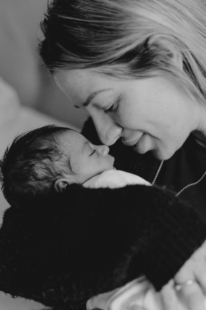 close up image of mum snuggling up to her newborn baby girl. Newborn photography in Hampshire. lovely moment between mum and a baby. Ewa Jones Photography