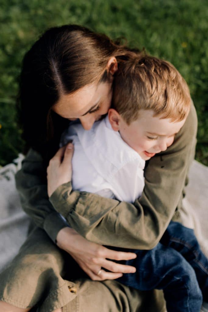 Claudia and Lorenzo-6 mum is cuddling her boy tightly. lovely mum and son photo session in the Spring. family photographer in Hampshire. Ewa Jones Photography