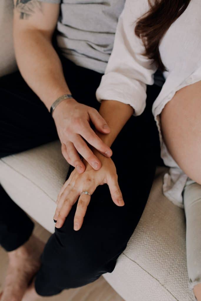close up of mum and dad holding hands. Maternity photo session in Hampshire. Hampshire photographer. Basingstoke photographer. Ewa Jones Photography