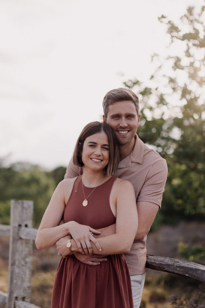 Mum and dad are cuddling close. family photo session in Hampshire. Ewa Jones Photography