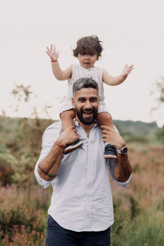 Family photo session in Surrey. Little boy is on daddy's shoulders. Family photographer. Family photo session outdoor. Ewa Jones Photography
