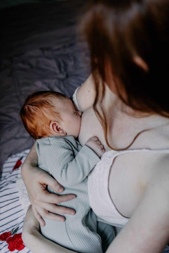 Mum is breastfeeding her little baby boy. newborn photo session. Newborn photographer. Ewa Jones Photographer