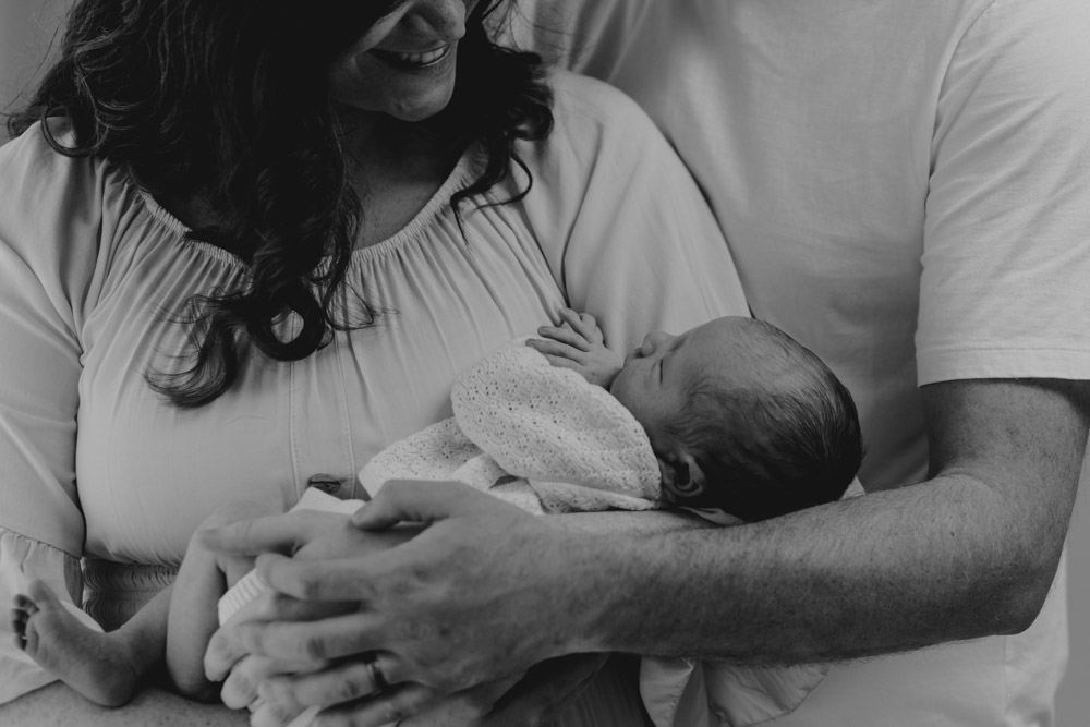 mum is holding newborn baby boy in her arms. Newborn poses. Ewa Jones Photography