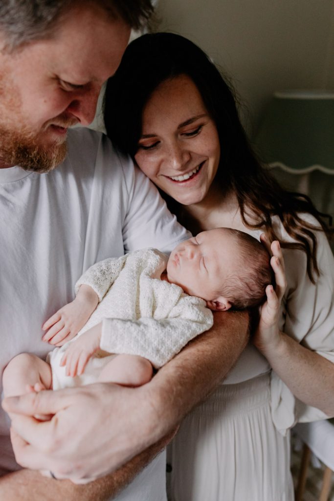 Show affection by gently holding or caressing the baby’s hands, feet, or head. Parents can also hold their little one close and snuggle them, which conveys warmth and closeness. Ewa jones Photography