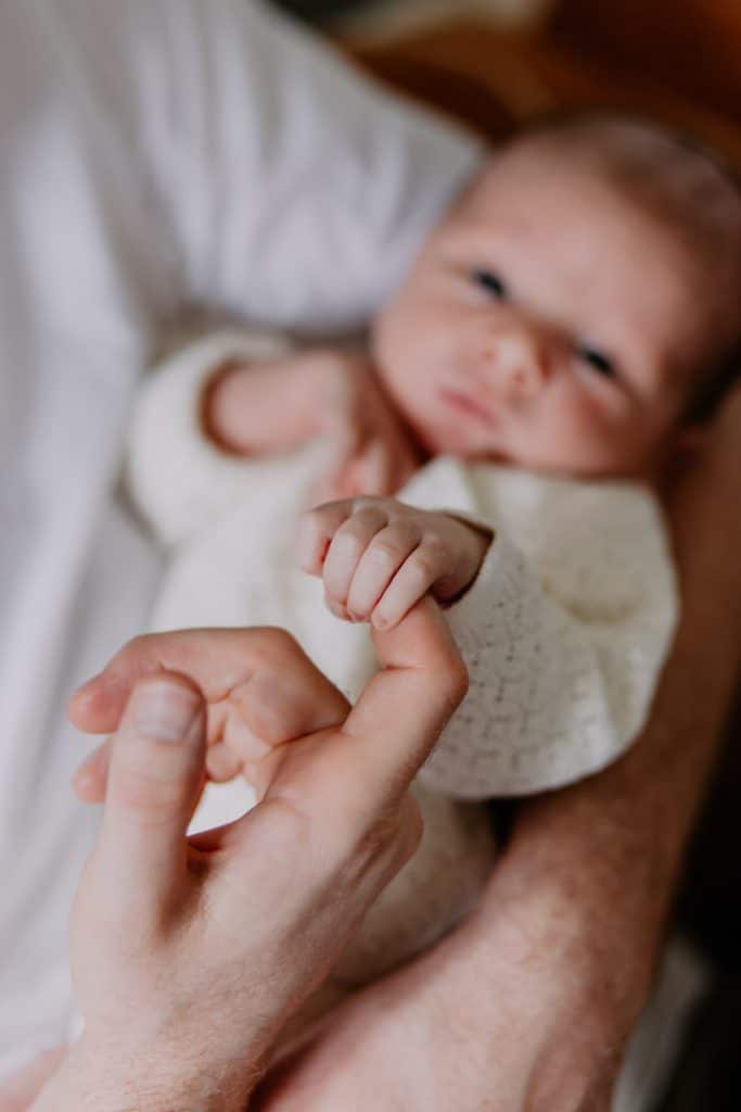 Close up detail of newborn baby fingers. In home newborn photography. Lifestyle newborn photo session. Hampshire family photographer. Ewa Jones Photography
