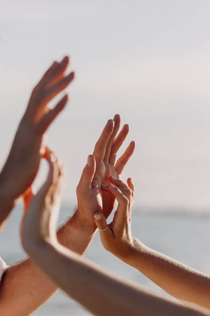 Close up of parents hands. Beach photo shoot. Beach photo shoot. Maternity photo session. Ewa Jones Photography