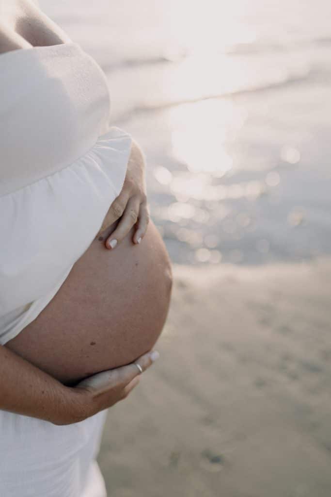 Baby bump. Close image of the bump. Sea side photo session. Maternity shoot at the beach. Hampshire photographer. Ewa Jones Photography