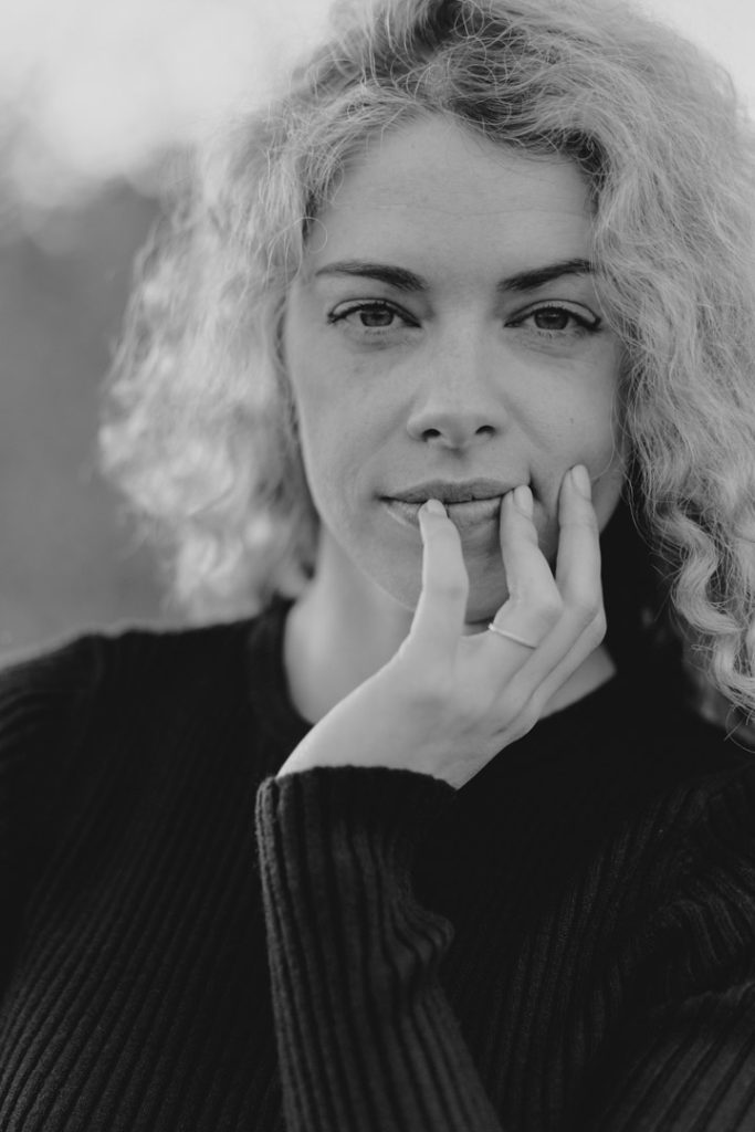 Female is looking at the photographer. female photo shoot outdoors. time to celebrate you. empowerment photo shoot. Hampshire and Basingstoke photographer. Ewa Jones Photography