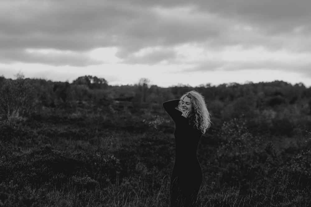 black and white image of female standing outside. natural female photo session. Hampshire photographer. Basingstoke photographer. Ewa Jones Photography