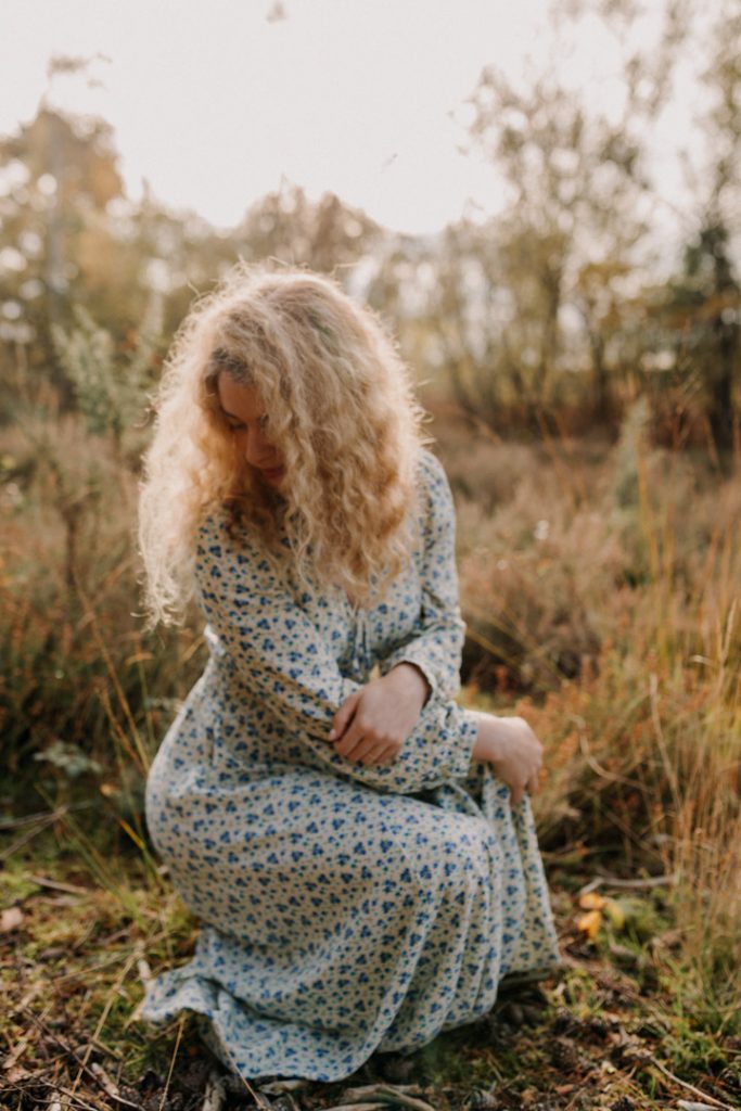 female is sitting in the nature reserve and looking away. female photo session outside in the nature. Time to celebrate you. Women photo session. Ewa Jones Photography