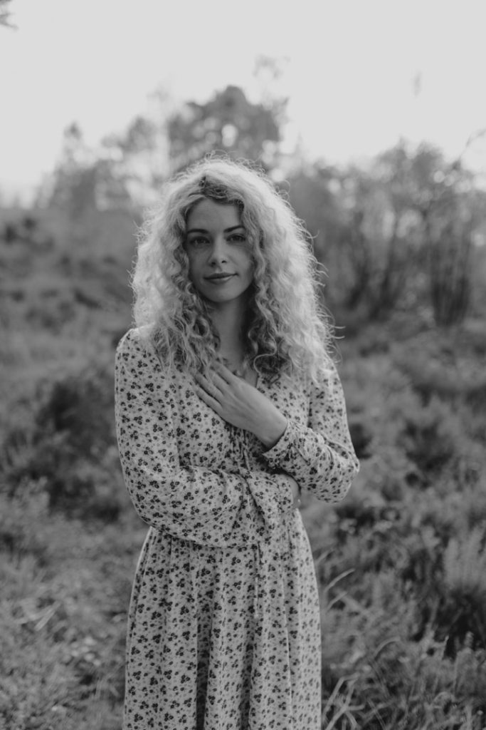 Black and white image or female standing in the nature common. natural outdoor woman photo session. Hampshire photographer. Ewa Jones Photography