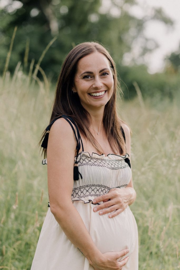 Mum holding baby bump. maternity photo shoot. Maternity photo session. Maternity dress. Hampshire photographer. Ewa Jones Photography
