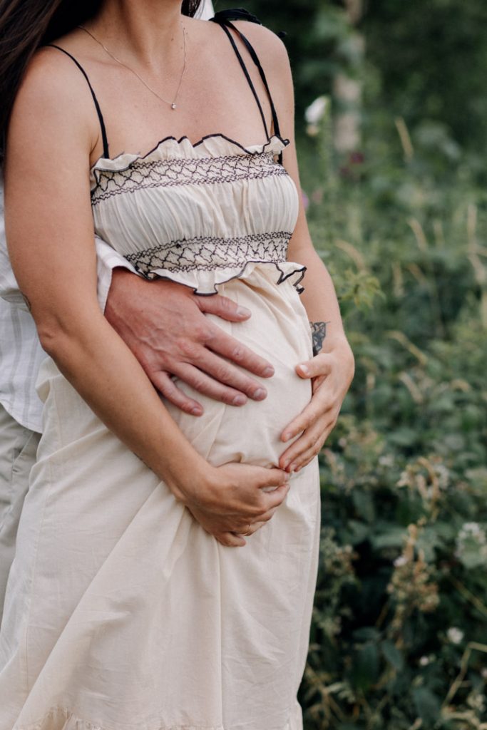 Close up of dad and mum cuddling baby bump. family and maternity session in Hampshire. Ewa Jones photography