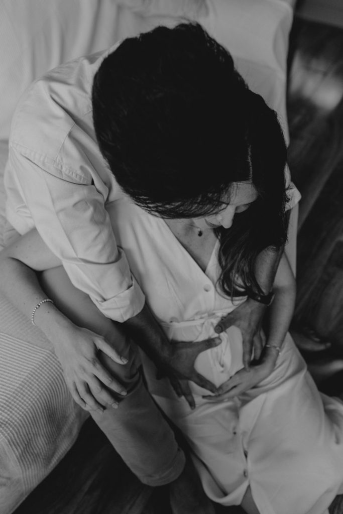 o be are cuddling close. Exciting waiting for baby session. Natural photo session. In home pregnancy session. Hampshire photographer. Ewa Jones Photography