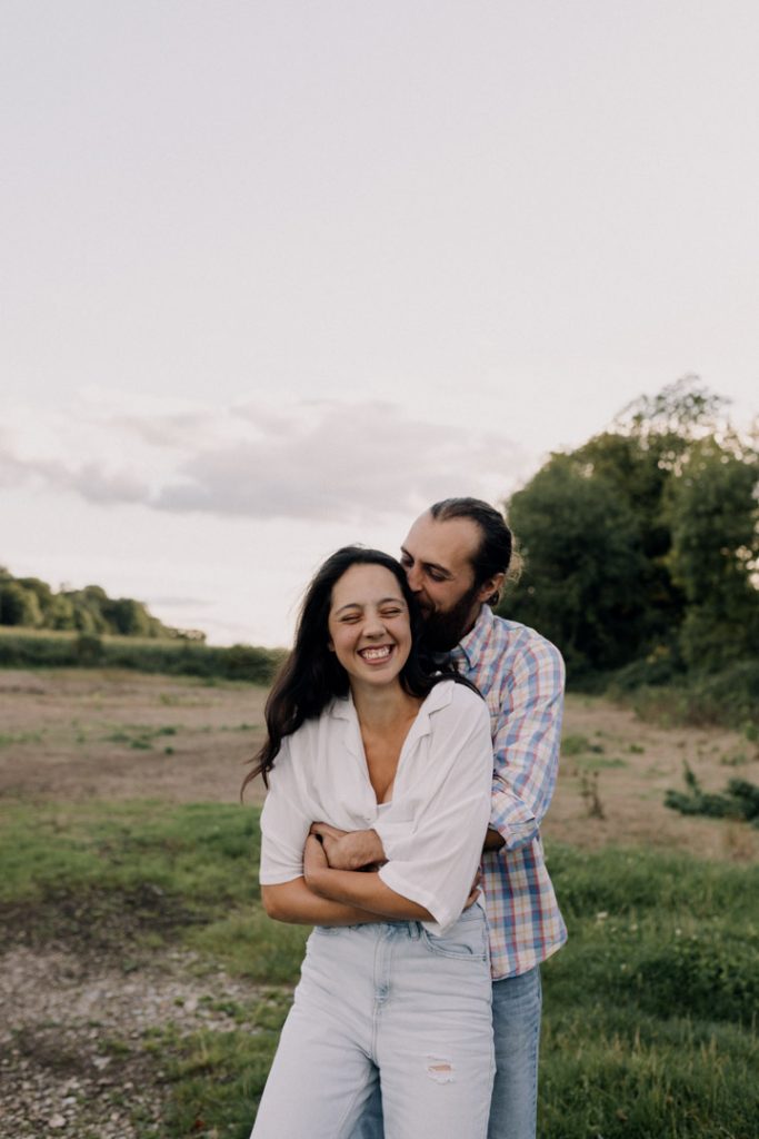 Couple is hugging each other and smiling. Hampshire couple photo shoot. Hampshire family photographer. Ewa Jones Photography