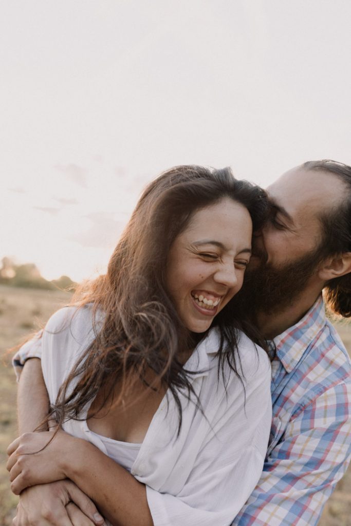 Couple is smiling and laughing. Lovely natural moment captured on frame. Hampshire photo session. Basingstoke photographer. Basingstoke photo shoot. Ewa Jones Photography