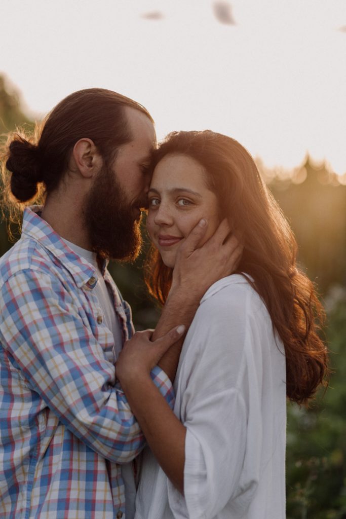 Lovely intimate image of couple being close with each other. female is looking at the camera. Couple photo session in Basingstoke. Hampshire photo session. Ewa Jones Photography