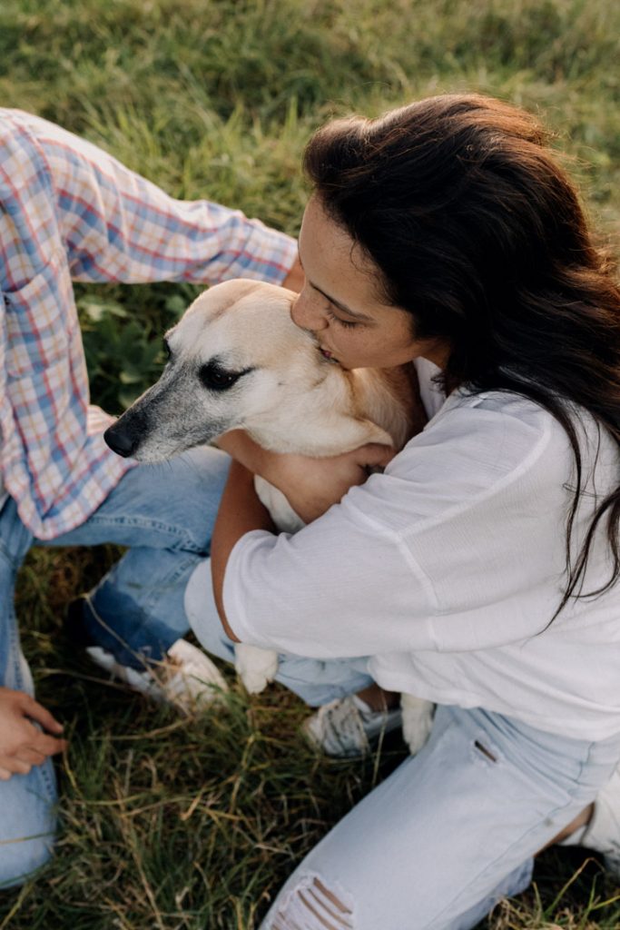 Female is kissing her dog. Great couple photo session with a pet. Hampshire photo shoot. Hampshire photographer. Ewa Jones Photography