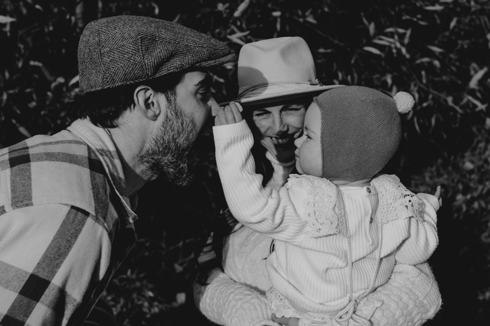 lovely candid moment during outdoor family photo session. outside photo shoot for one year old. Winchester photo shoot. Basingstoke photographer. Ewa Jones Photography