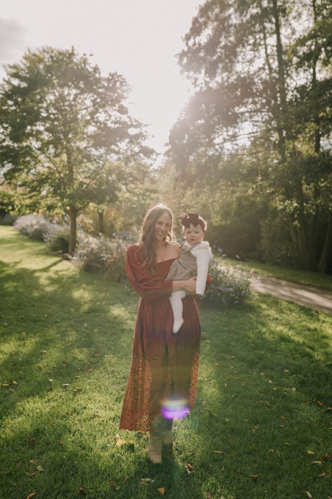 Mum is walking with her daughter towards the photographer. Natural golden hour photo shoot. Hampshire shoot. Hampshire family photographer. Ewa Jones Photography