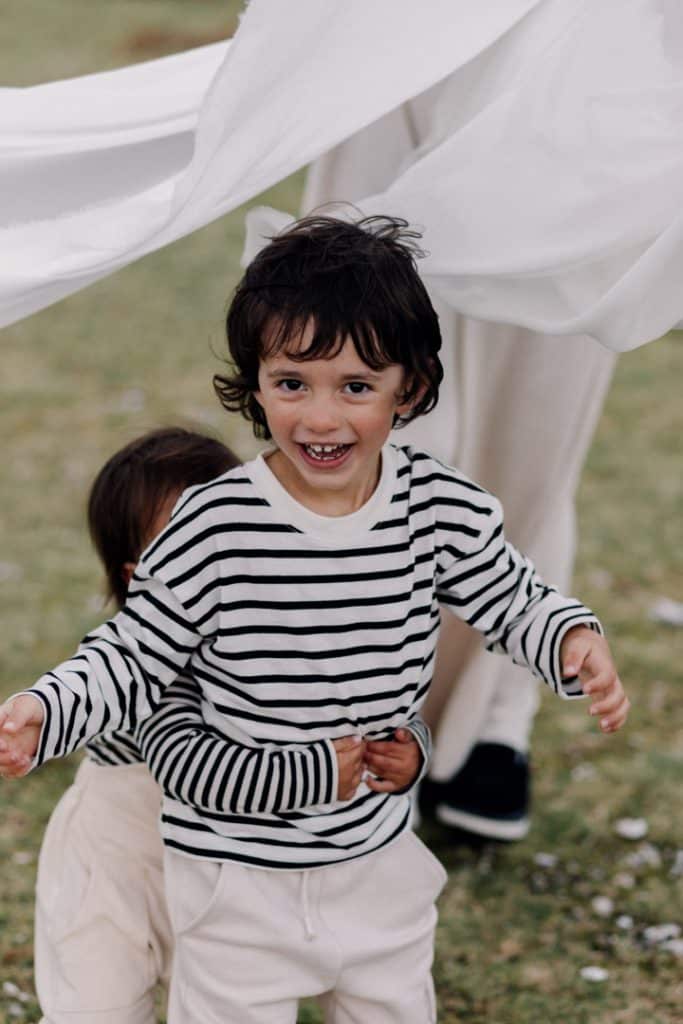 two brothers are playful during family shoot. Hampshire photographer. Ewa Jones Photography