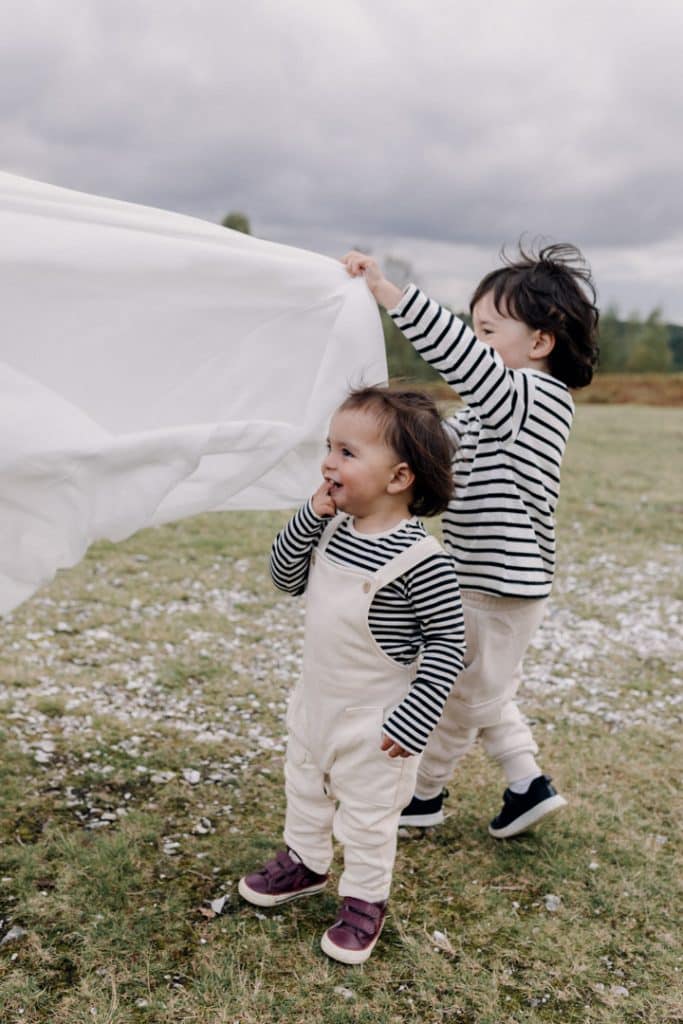Playful natural moments captured during family photo session. Hampshire photographer. Ewa Jones Photography