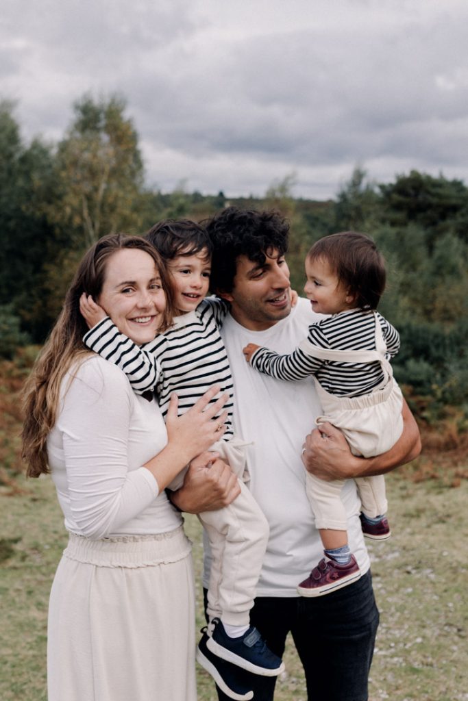 Family is cuddling close. Hampshire photographer. Family photo session in the New Forest. Hampshire family photo shoot. Ewa Jones Photography