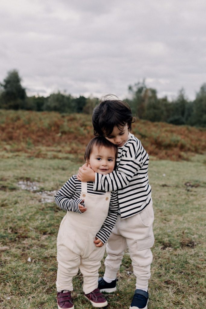 Brothers are cuddling close together. Hampshire family photographer. Ewa Jones Photography