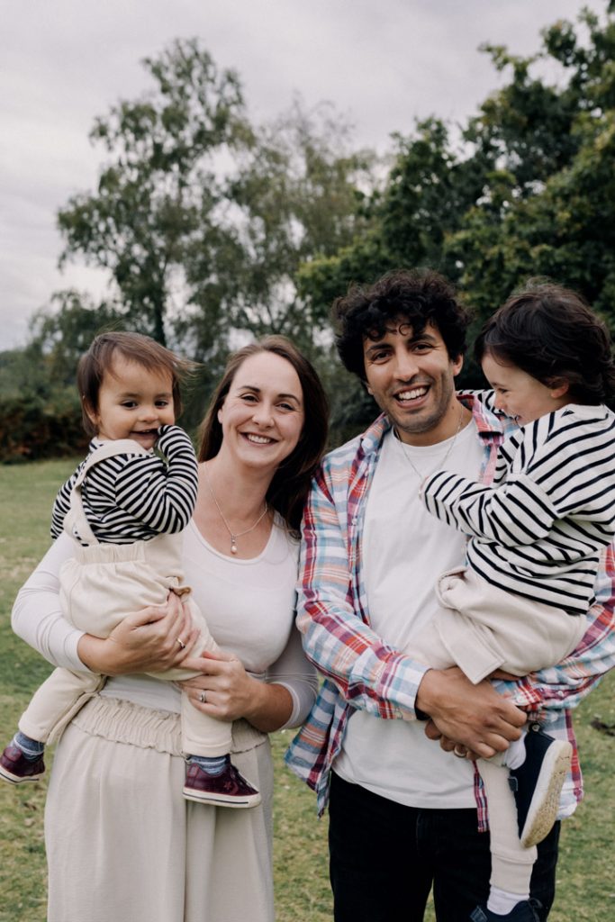 Mum and dad are looking at the camera and smiling. Lovely family photo shoot in the New Forest. Hampshire photographer. Ewa Jones Photography