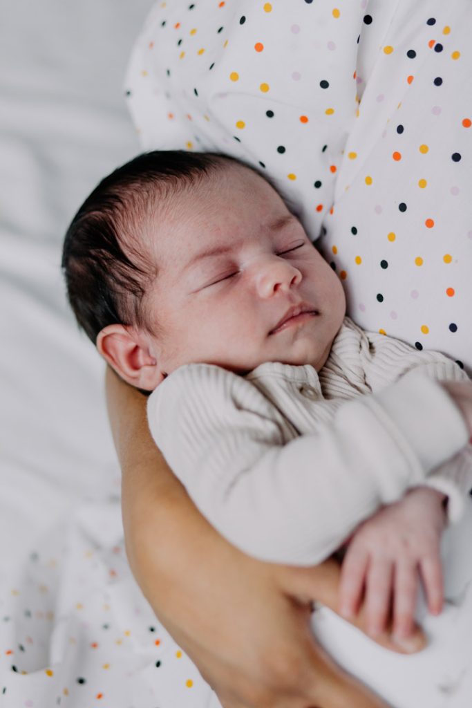 baby close up, baby is sleeping during newborn photo session. Hampshire in home newborn photo shoot. Ewa Jones Photography