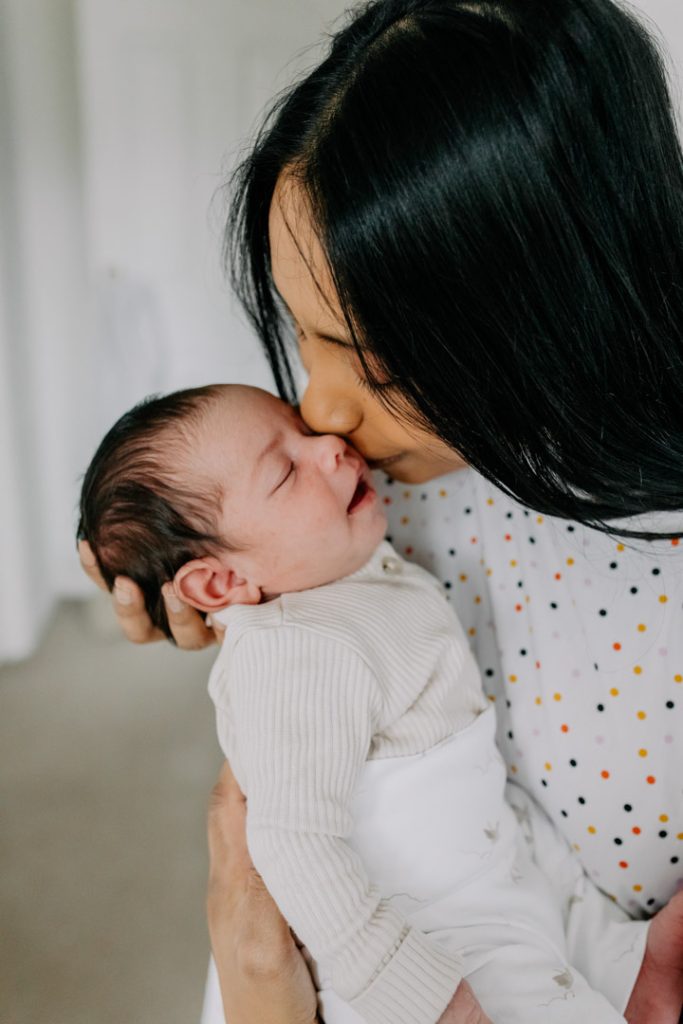 Mum is kissing newborn baby. Hampshire newborn photo session. Ewa jones Photography